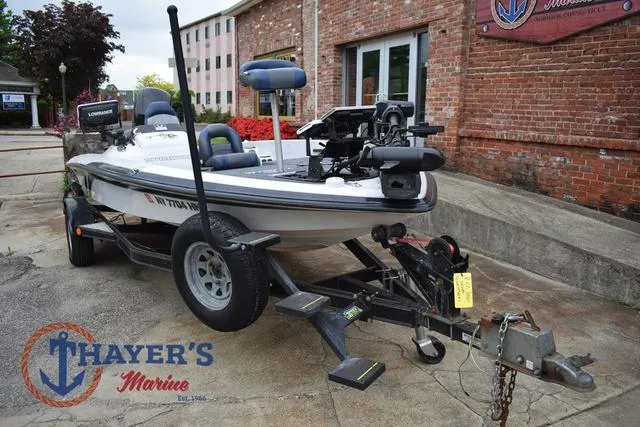 Slide: The Image of 1997 Pro Craft 180 boat on trailer at Thayer's Marine dealership. - 8