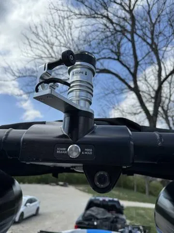 Slide: The Image of Close-up of a 2022 MasterCraft X24 boat component against a cloudy sky background. - 16