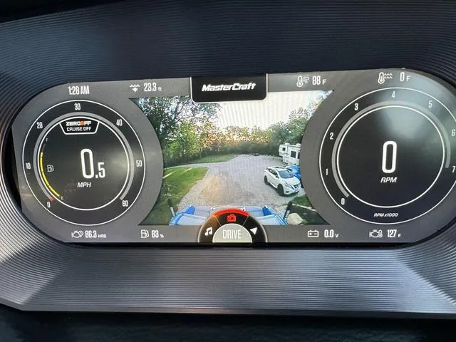 Slide: The Image of 2022 MasterCraft X24 dashboard display with speedometer, RPM, and rearview camera. - 19