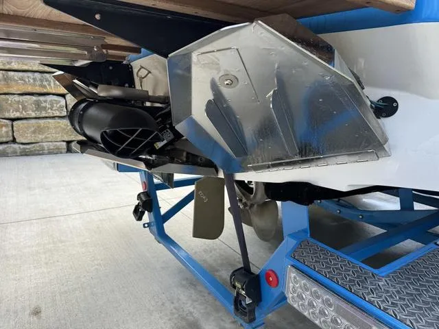 Slide: The Image of 2022 MasterCraft X24 boat trailer with propeller and hull details. - 24