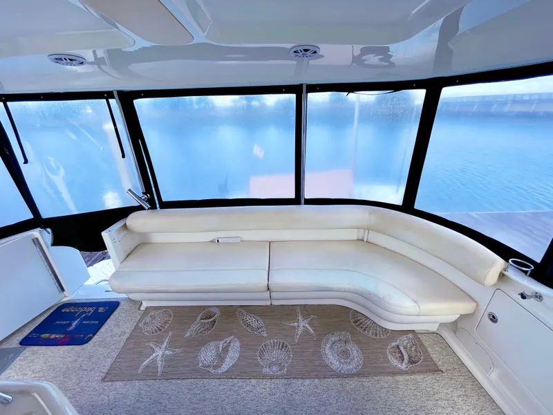 Slide: The Image of Luxurious 2005 Sea Ray Motor Yacht interior with white leather seating and panoramic windows. - 12