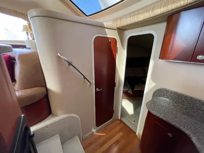 Slide: The Image of 2005 Sea Ray Motor Yacht interior with wood flooring, stairs, and cabin door. - 19