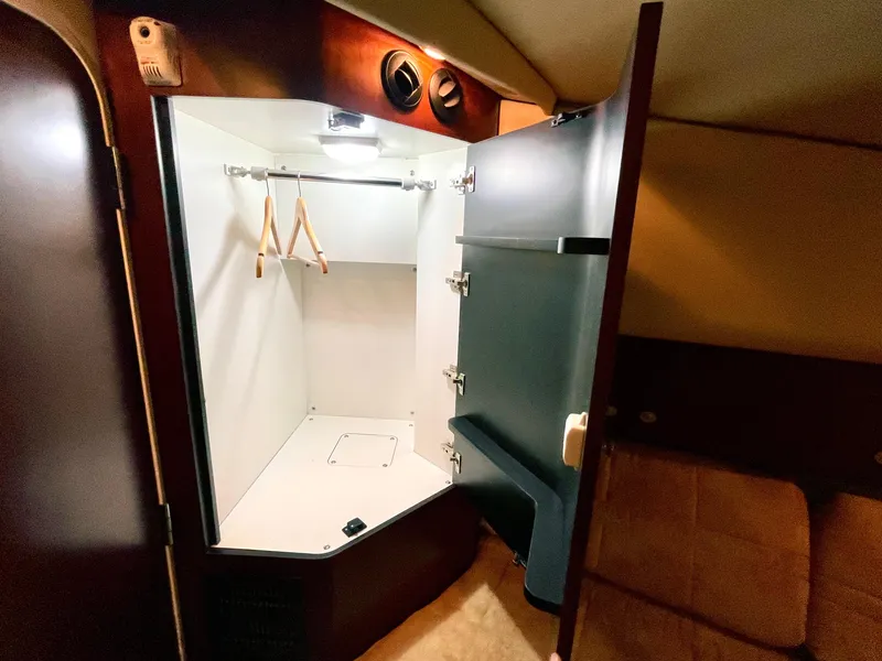 Slide: The Image of 2005 Sea Ray Motor Yacht interior closet with hangers and lighting. - 22