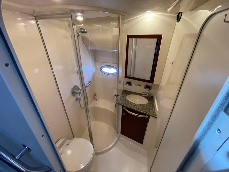 Slide: The Image of Luxurious 2005 Sea Ray Motor Yacht bathroom with shower, sink, and toilet. - 23