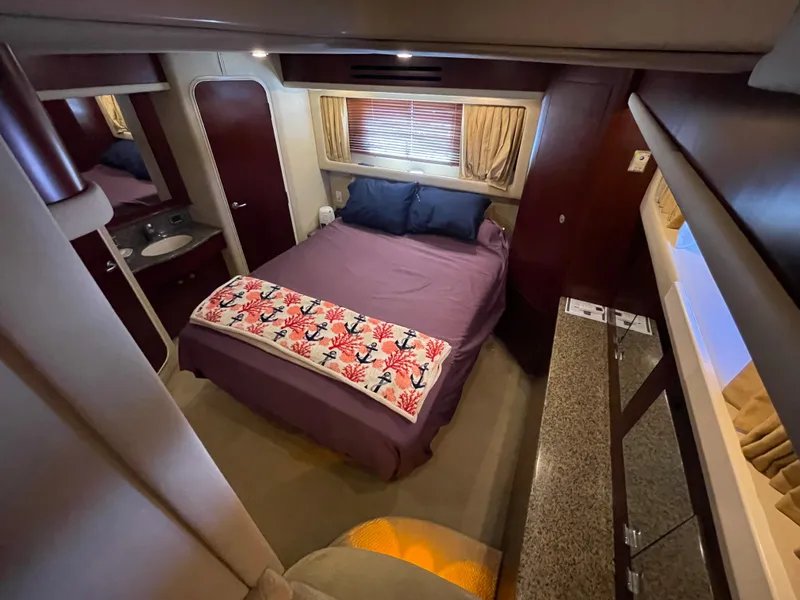 Slide: The Image of Luxurious bedroom interior of 2005 Sea Ray Motor Yacht with cozy bed and elegant decor. - 25