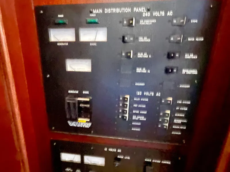 Slide: The Image of Main distribution panel on 2005 Sea Ray Motor Yacht, showing electrical controls and switches. - 29