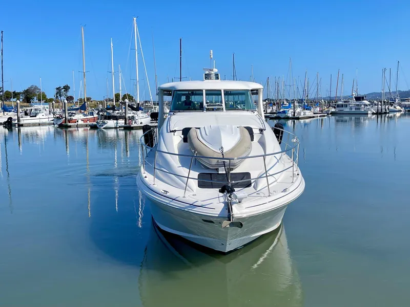 Slide: The Image of 2005 Sea Ray Motor Yacht docked in a marina, surrounded by sailboats. - 3