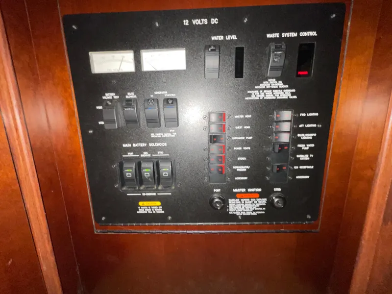 Slide: The Image of Control panel of a 2005 Sea Ray Motor Yacht, featuring switches and gauges. - 30