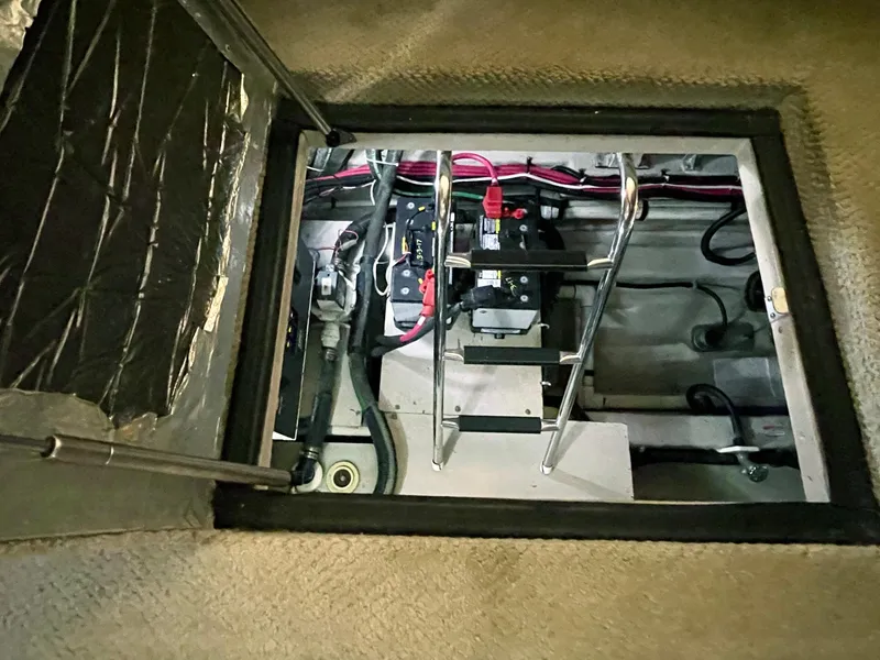 Slide: The Image of Engine compartment of a 2005 Sea Ray Motor Yacht, showing wiring and mechanical components. - 31