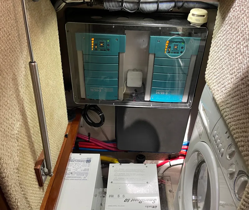 Slide: The Image of Engine room of 2005 Sea Ray Motor Yacht with electrical components and washer. - 32