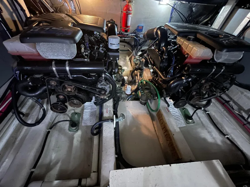 Slide: The Image of Engine room of a 2005 Sea Ray Motor Yacht with dual engines and fire extinguisher. - 33