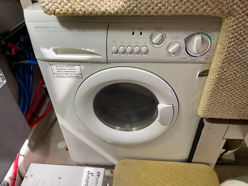 Slide: The Image of Washing machine inside a 2005 Sea Ray Motor Yacht laundry area. - 35