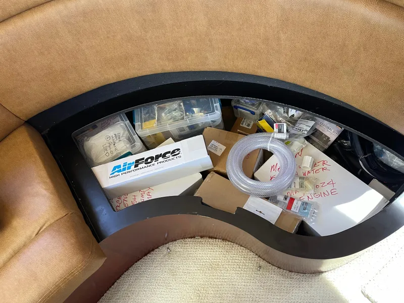 Slide: The Image of Storage compartment in a 2005 Sea Ray Motor Yacht filled with various boating supplies. - 38