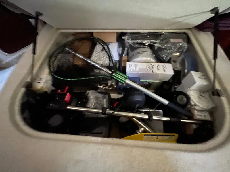 Slide: The Image of Storage compartment of a 2005 Sea Ray Motor Yacht filled with various boating equipment. - 39