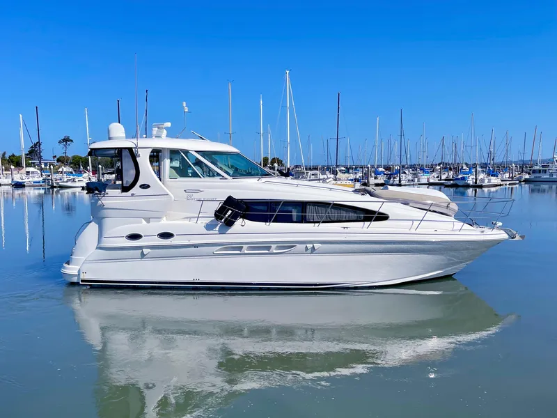 Slide: The Image of 2005 Sea Ray Motor Yacht docked in a marina, reflecting on calm water. - 5
