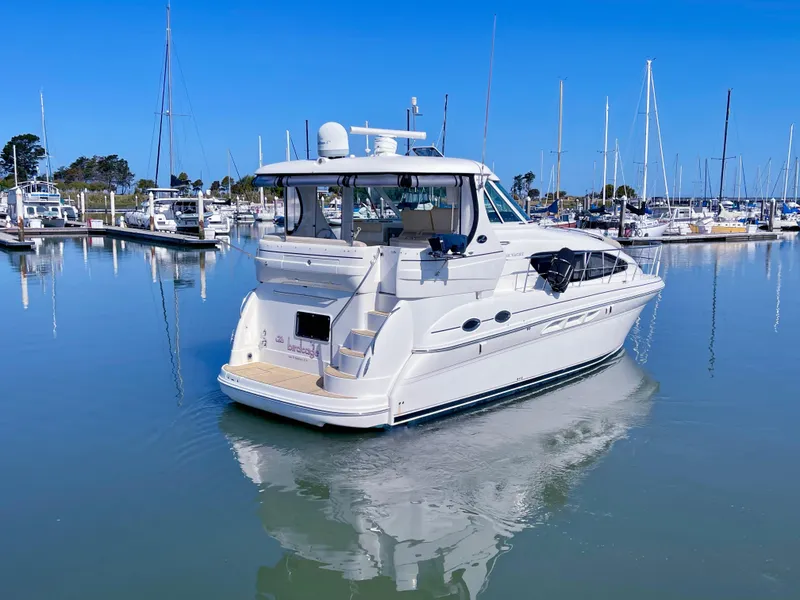 Slide: The Image of 2005 Sea Ray Motor Yacht docked in a serene marina setting. - 6