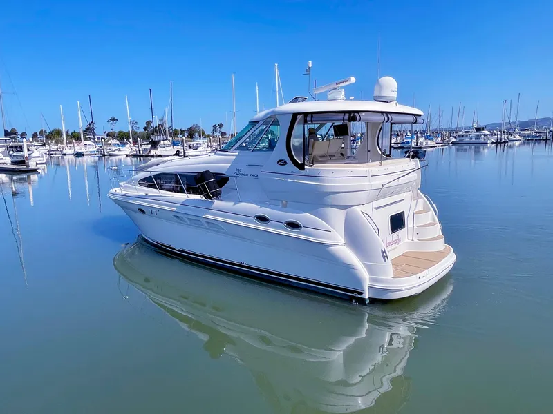 Slide: The Image of 2005 Sea Ray Motor Yacht docked in a serene marina setting. - 8