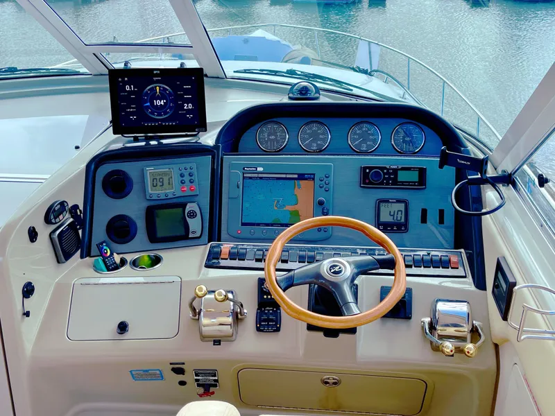 Slide: The Image of 2005 Sea Ray Motor Yacht helm with navigation instruments and steering wheel. - 9