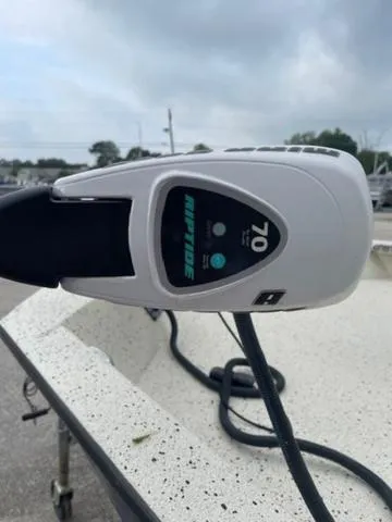 Slide: The Image of Close-up of a 2019 Xpress SW20B boat motor, featuring a 70 HP rating. - 3