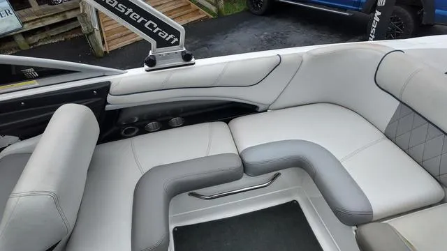 Slide: The Image of 2011 MasterCraft X45 boat interior with white and gray seating. - 13