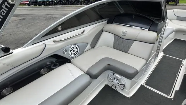Slide: The Image of 2011 MasterCraft X45 boat interior with gray seating and speaker system. - 14