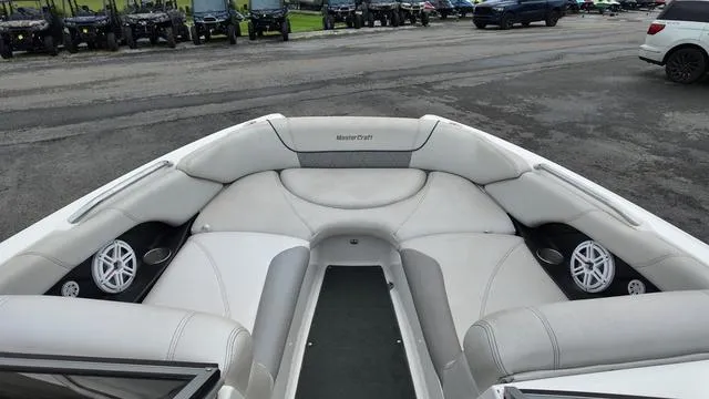 Slide: The Image of 2011 MasterCraft X45 boat interior with white seating and speakers. - 16