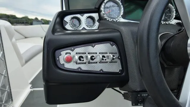 Slide: The Image of Dashboard of a 2011 MasterCraft X45 boat with gauges and control switches. - 18