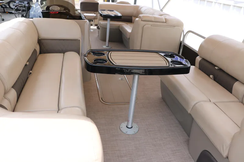 Slide: The Image of Interior of 2020 Sun Tracker SportFish 22 XP3 pontoon boat with beige seating and tables. - 15