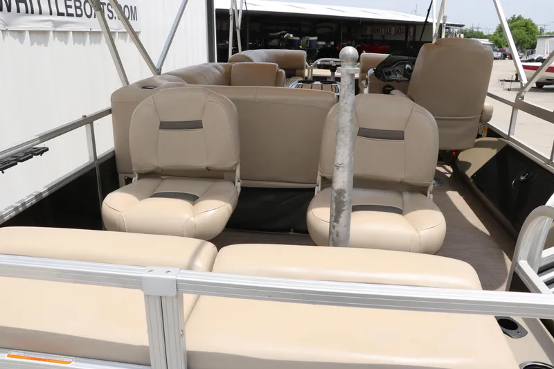 Slide: The Image of 2020 Sun Tracker SportFish 22 XP3 pontoon boat interior with beige seating. - 18