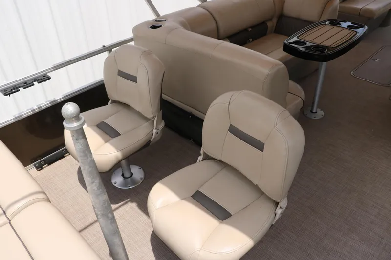 Slide: The Image of 2020 Sun Tracker SportFish 22 XP3 interior with beige seating and table. - 20