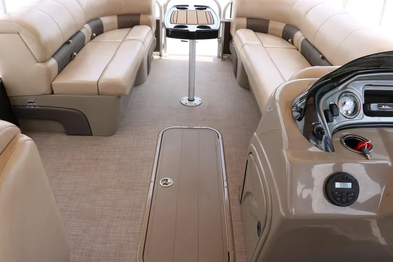 Slide: The Image of Interior of 2020 Sun Tracker SportFish 22 XP3 pontoon boat with beige seating and control panel. - 23