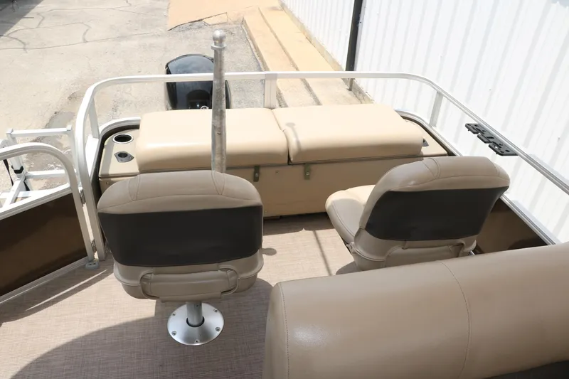 Slide: The Image of 2020 Sun Tracker SportFish 22 XP3 boat interior with beige seating and fishing chairs. - 28