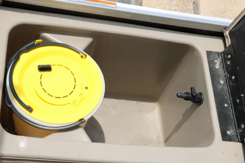 Slide: The Image of Livewell compartment with yellow bucket in 2020 Sun Tracker SportFish 22 XP3 boat. - 29