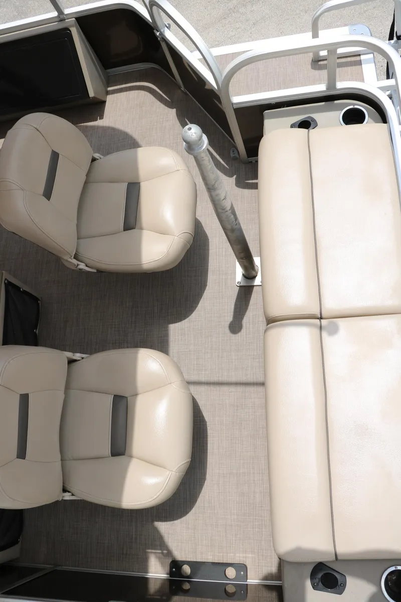 Slide: The Image of 2020 Sun Tracker SportFish 22 XP3 interior with beige seating and cup holders. - 33