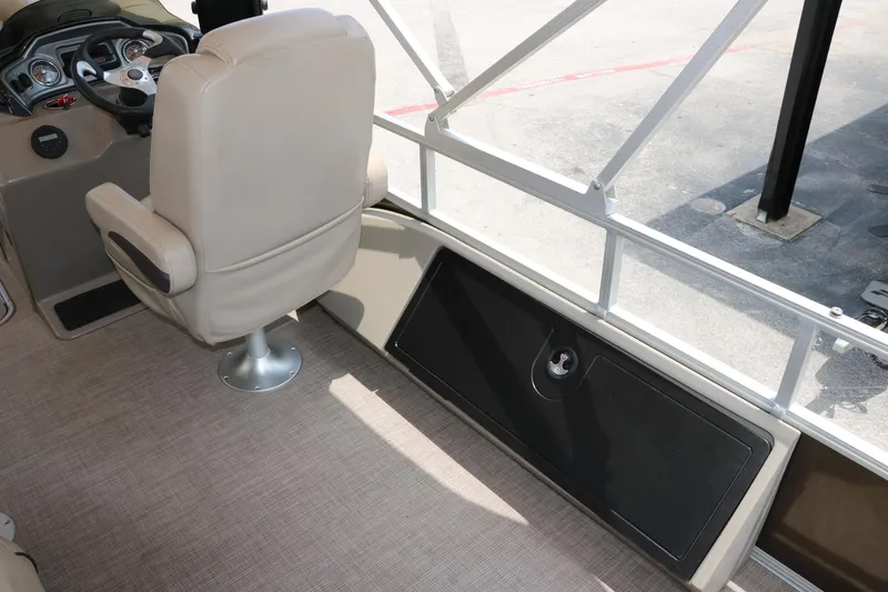 Slide: The Image of 2020 Sun Tracker SportFish 22 XP3 interior with beige seating and control panel. - 34