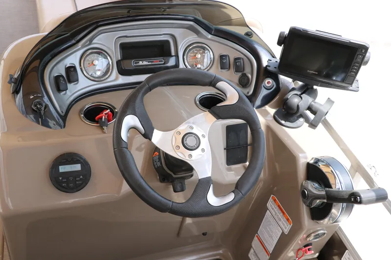 Slide: The Image of 2020 Sun Tracker SportFish 22 XP3 dashboard with steering wheel and navigation system. - 35