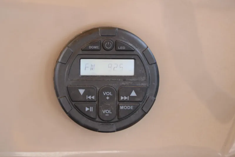 Slide: The Image of 2020 Sun Tracker SportFish 22 XP3 boat stereo system displaying FM 92.5. - 36