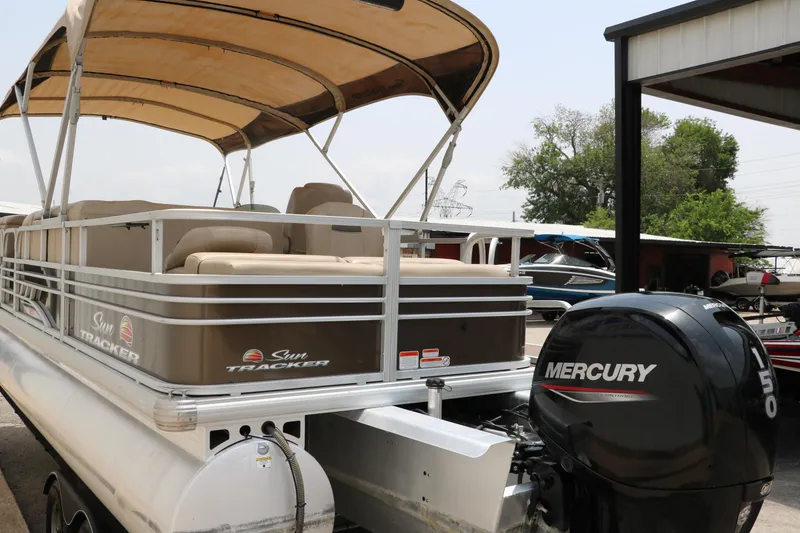 Slide: The Image of 2020 Sun Tracker SportFish 22 XP3 pontoon boat with Mercury outboard motor. - 4