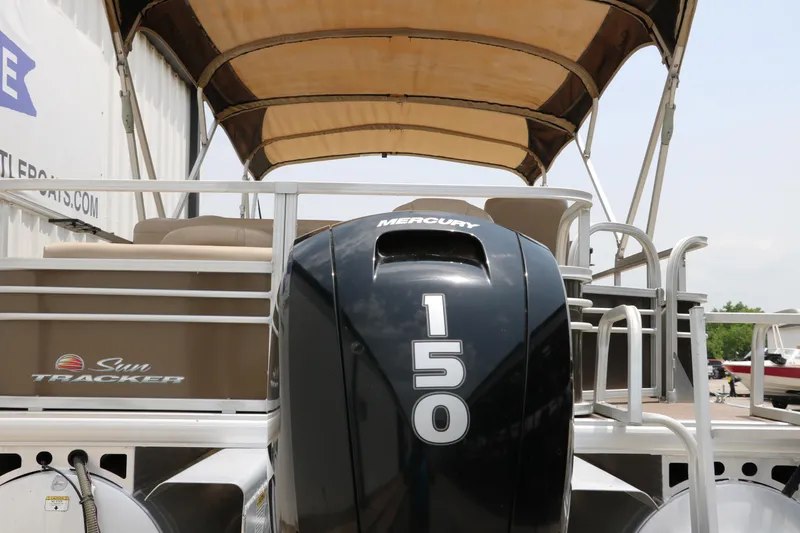 Slide: The Image of 2020 Sun Tracker SportFish 22 XP3 with Mercury 150 engine, under a canopy. - 5