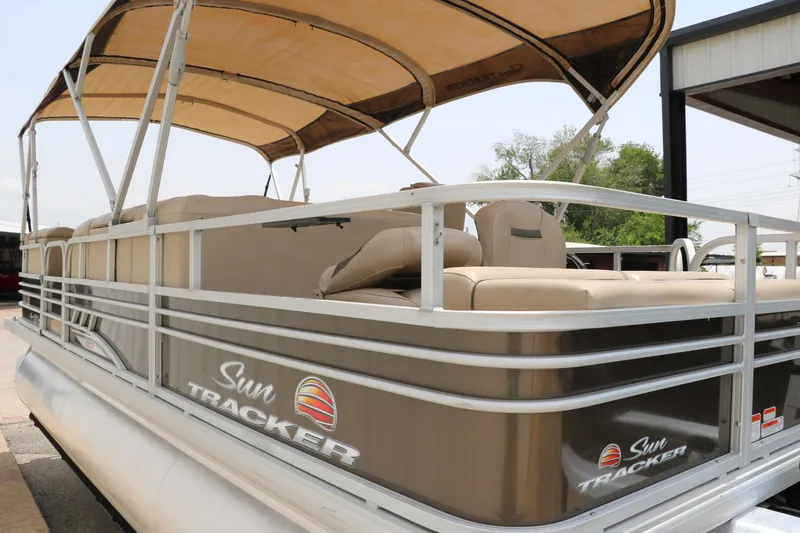 Slide: The Image of 2020 Sun Tracker SportFish 22 XP3 pontoon boat with beige seating and canopy. - 6