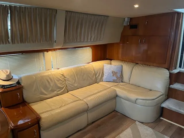 Slide: The Image of Luxurious interior of 2005 Carver 46 Motor Yacht with beige leather seating. - 18