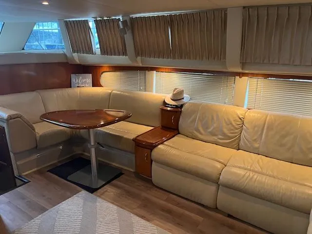 Slide: The Image of Luxurious interior of 2005 Carver 46 Motor Yacht with beige leather seating. - 20