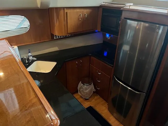 Slide: The Image of Luxurious kitchen interior of 2005 Carver 46 Motor Yacht with modern appliances. - 23