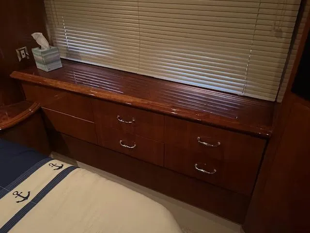 Slide: The Image of Interior of 2005 Carver 46 Motor Yacht with wooden drawers and blinds. - 29