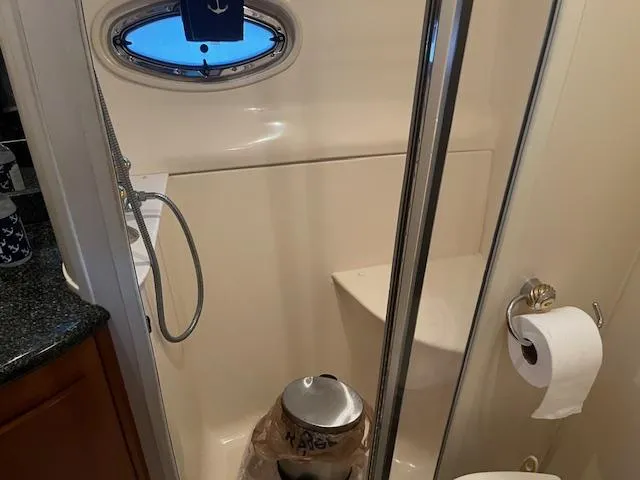 Slide: The Image of Bathroom interior of 2005 Carver 46 Motor Yacht with shower and porthole window. - 31