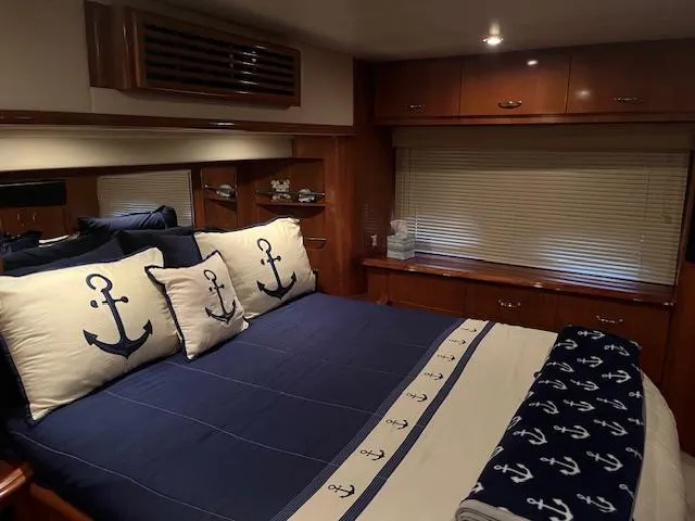 Slide: The Image of Luxurious bedroom in 2005 Carver 46 Motor Yacht with nautical-themed decor. - 38