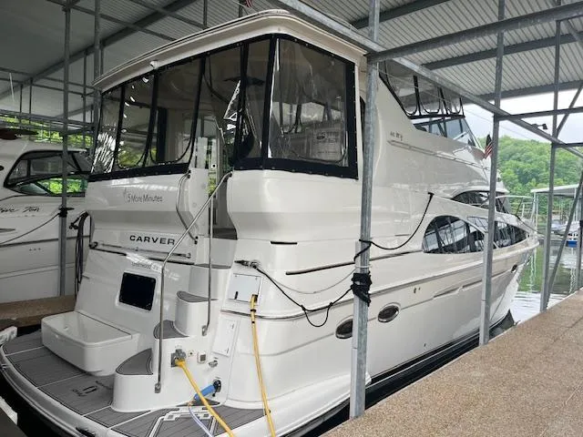 Slide: The Image of 2005 Carver 46 Motor Yacht docked in a covered marina. - 6