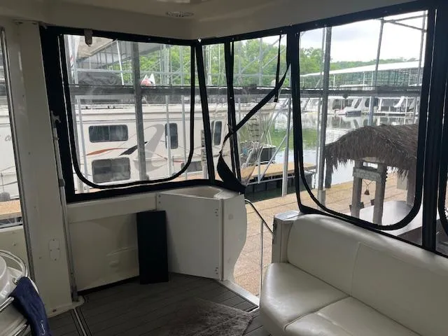 Slide: The Image of Interior view of 2005 Carver 46 Motor Yacht with marina backdrop. - 8