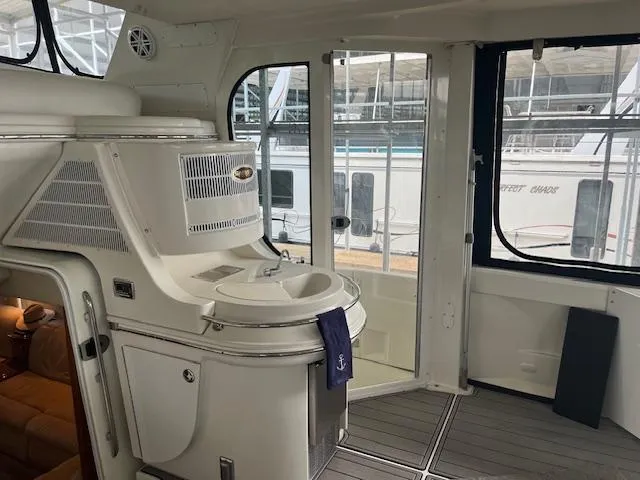 Slide: The Image of 2005 Carver 46 Motor Yacht interior with modern amenities and spacious design. - 9