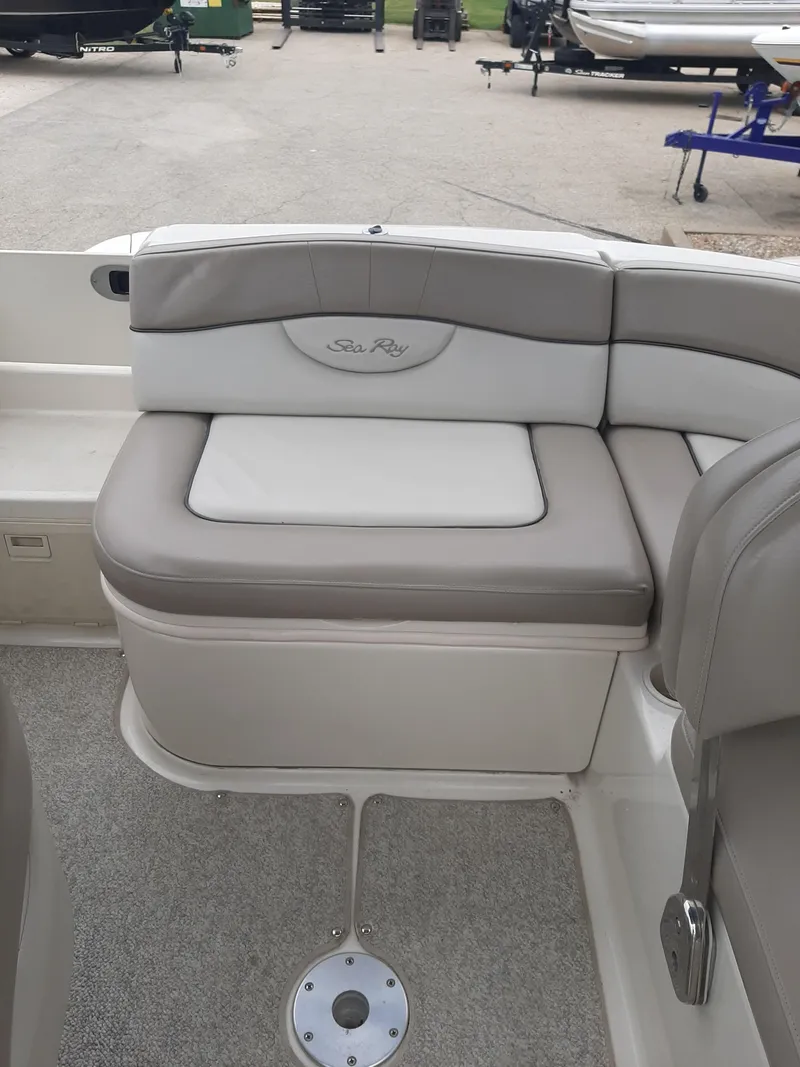 Slide: The Image of 2004 Sea Ray SunDeck 200 boat seating area with gray and white upholstery. - 5